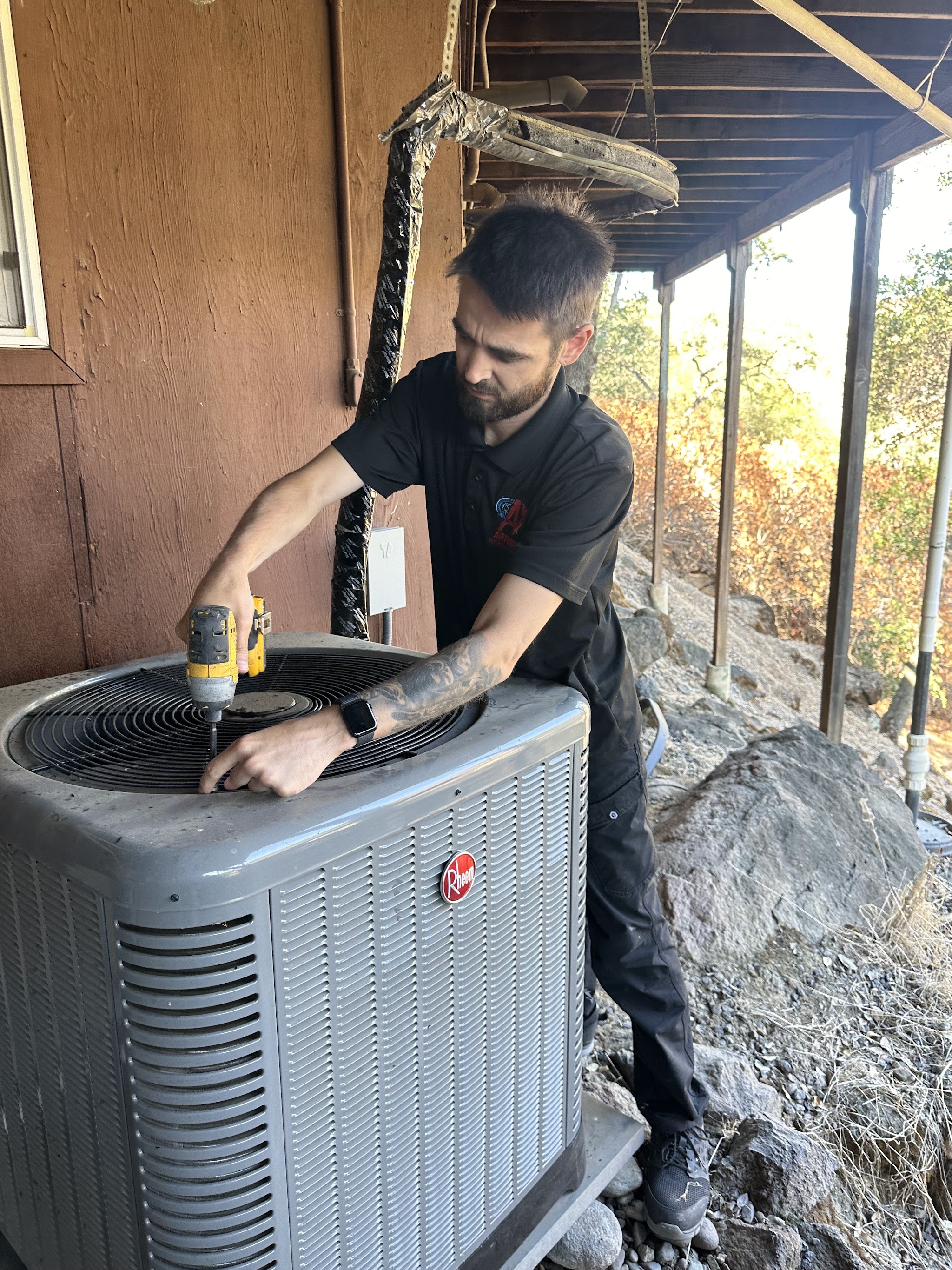 Technician installing an outdoor AC condenser unit